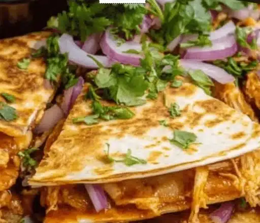 Delicious BBQ chicken quesadillas served with dipping sauce