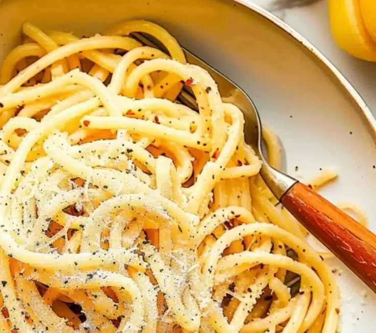 Delicious Black Pepper Parmesan Pasta Twirls served in a bowl with herbs