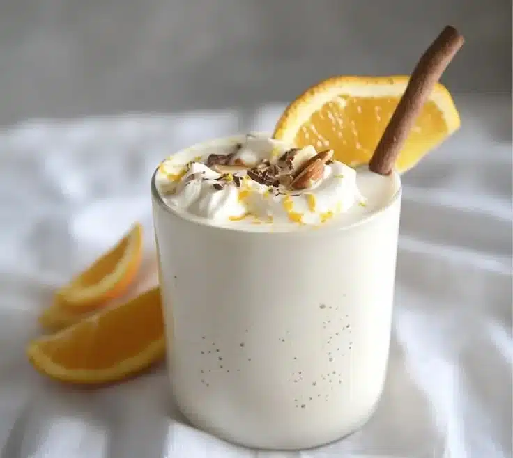 Creamy White Chocolate Orange Almond Cocoa for Winter Bliss 9 Creamy white chocolate orange almond cocoa in a cozy winter setting