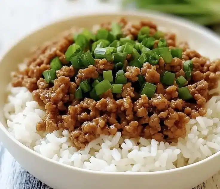 Delicious ground turkey over rice in a bowl, perfect for a quick weeknight dinner.