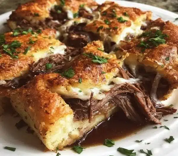 Delicious French Dip Squares served with au jus for dipping