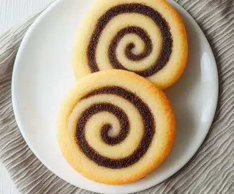 Fun And Easy Pinwheel Cookies 4 Deliciously swirled pinwheel cookies on a plate ready to enjoy