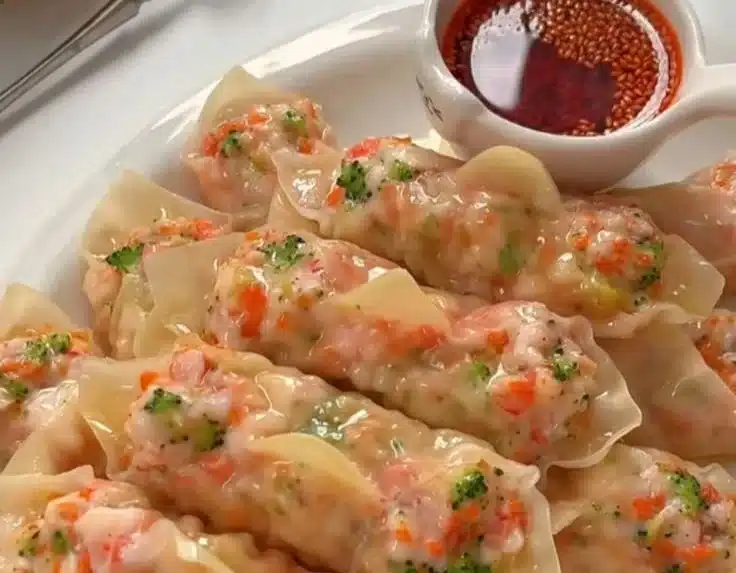 Low-calorie veggie shrimp dumplings served with dipping sauce.