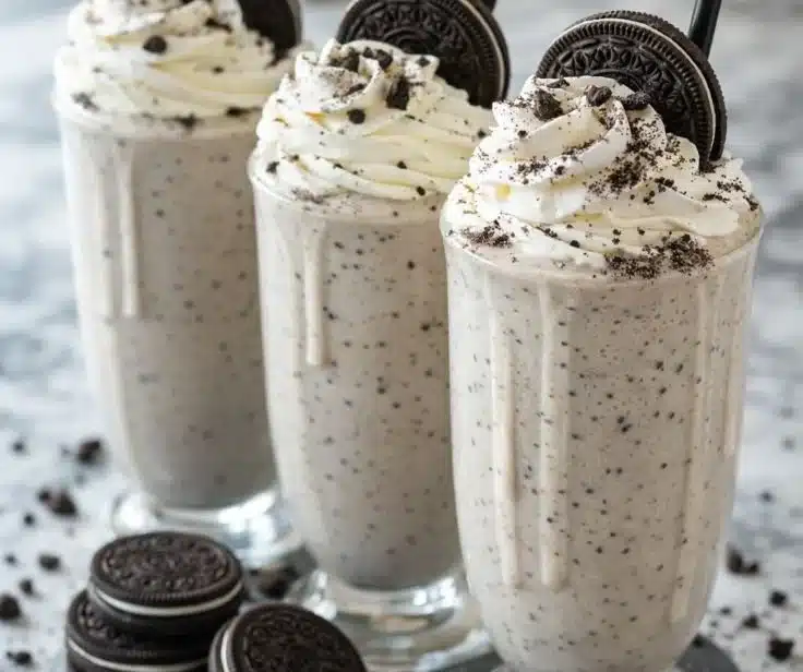 Delicious Oreo Milkshake topped with whipped cream and Oreo cookies