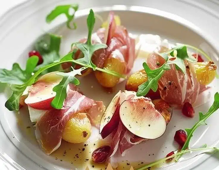 Prosciutto-Wrapped Peaches 7 Delicious plate of prosciutto-wrapped peaches garnished with herbs.