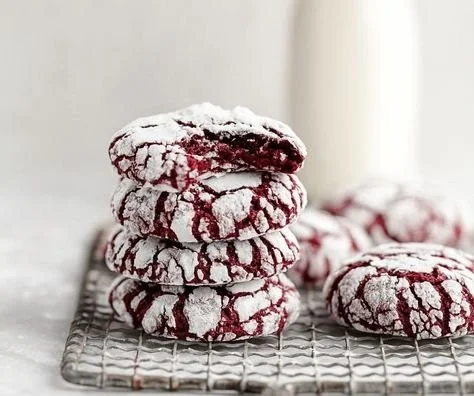 Red Velvet Crinkle Cookies fresh out of the oven, dusted with powdered sugar.