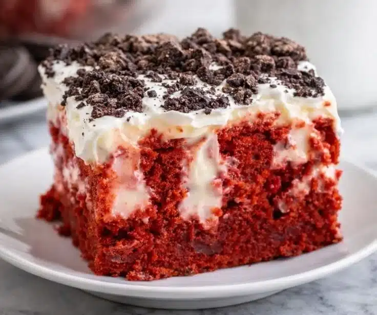 Delicious Red Velvet Poke Cake topped with cream cheese frosting