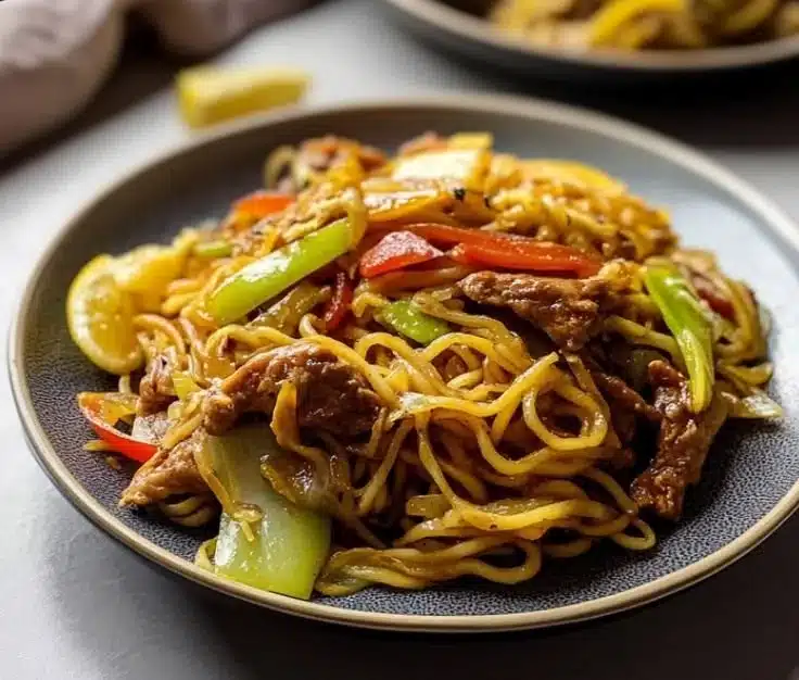 Vegan Pancit Canton (Filipino Stir-Fry Noodles) 8 Bowl of Vegan Pancit Canton with colorful vegetables and stir-fried noodles