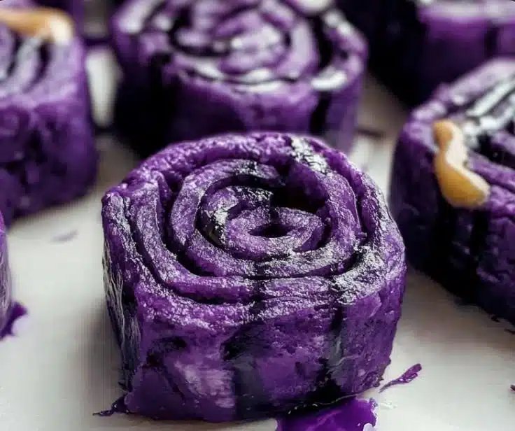 Vegan Ube Rolls 4 Delicious vegan ube rolls with vibrant purple color and creamy texture.