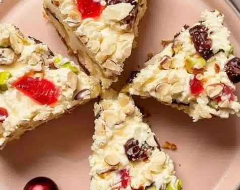 Delicious White Christmas Slice stacked on a festive plate