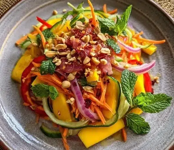 Zesty Thai mango salad with fresh mango, herbs, and a tangy dressing