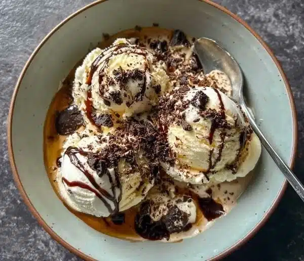 Dirty Snowman Baileys ice cream cocktail served in a glass with toppings.