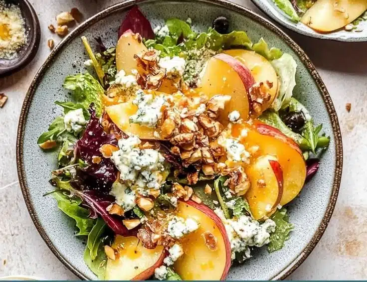 A delicious Pear and Blue Cheese Salad drizzled with Shallot Vinaigrette.