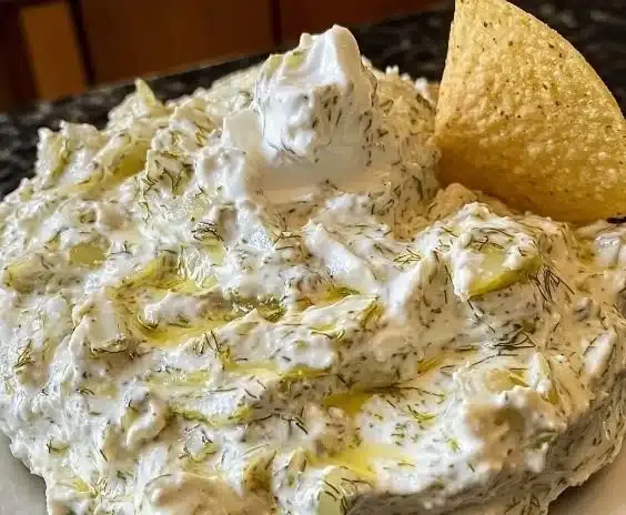 Creamy Dill Pickle Dip served with chips and fresh vegetables