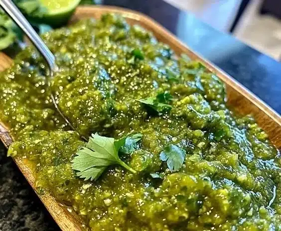 Bowl of homemade Green Tomatillo Salsa with fresh ingredients