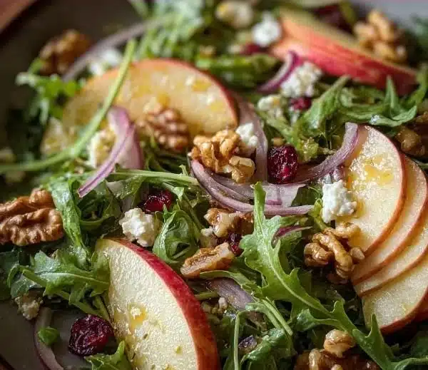 Fresh Apple Arugula Salad with walnuts and vinaigrette dressing