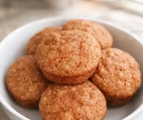 Moist apple muffins for babies on a wooden table