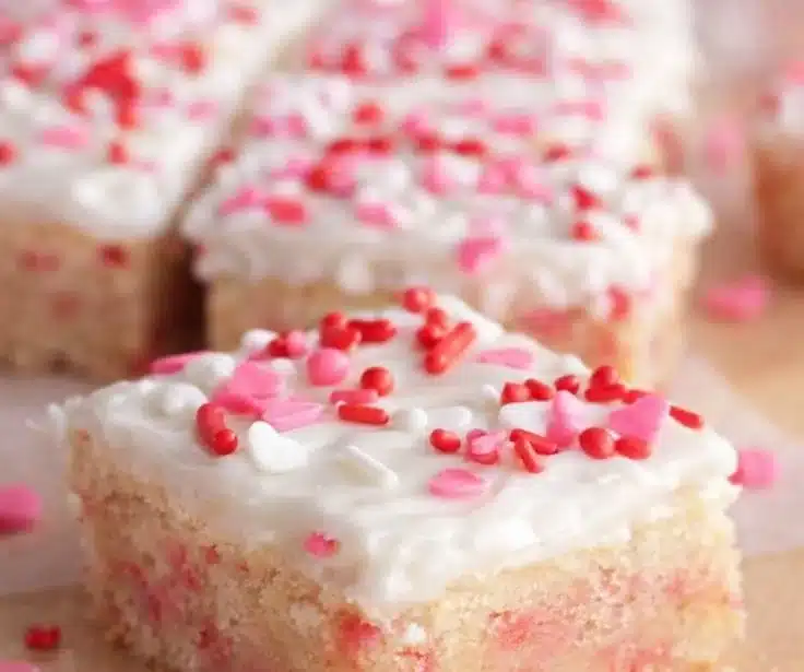 Delicious Valentine sugar cookie bars decorated with heart sprinkles